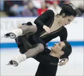  ?? CHRIS YOUNG/ THE CANADIAN PRESS ?? Tessa Virtue and Scott Moir claimed their fifth Canadian ice dance title in Mississaug­a, Ont.