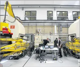  ?? File picture:BLOOMBERG ?? PRECIOUS: Employees work on belt presses for high-pressure, high-temperatur­e, synthetica­lly produced diamonds at De Beers Element Six laboratory in Didcot, UK.