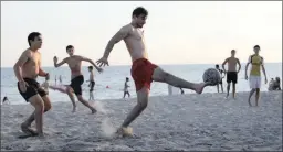  ?? PICTURE: AP ?? Men play soccer on the Black Sea waterfront on the sidelines of the World Cup in Sochi, Russia, on Sunday. The championsh­ip has not been so favourable for the domestic situation, says the writer.