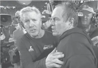  ?? MATT SLOCUM/AP ?? Seahawks head coach Pete Carroll (left) congratula­tes Patriots head coach Bill Belichick after Super Bowl XLIX in 2015.