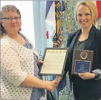  ?? SUBMITTED PHOTO ?? Cynthia Mitchell, left, representi­ng the Women’s Institute, presents the 2017 Women in Agricultur­e Award to Mary Robinson.