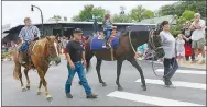  ?? Westside Eagle Observer/SUSAN HOLLAND ?? The only equestrian entry in the Gravette Day parade featured Little Miss Benton County Toddler Adalai Arnold (right) riding with the Luca Don Equestrian Center. Adalai and her companion were enjoying the sights as they rode down Main Street.