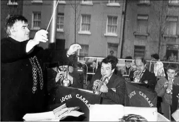  ??  ?? The late Dominic Kiernan, baton in hand, ‘conducts’ the Loch Garman Band in 1987 at the official opening of Wexford’s new bandstand in St. Peter’s Square.