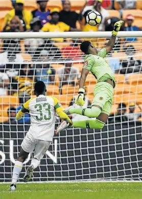  ?? Picture: LEFTY SHIVAMBU/GALLO IMAGES ?? HORROR ERROR: Mamelodi Sundowns’ Lebohang Maboe scores a goal in the final minutes, unhindered by Kaizer Chiefs goalkeeper Virgil Vries, during the Absa Premiershi­p match at the FNB Stadium on Saturday