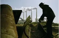  ?? Photo: AFP ?? A worker cuts steel pipes near a coal-burning power station in Hebei province. Price pressure on the fuel is growing.