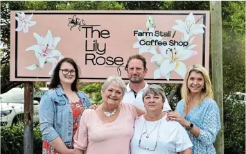  ?? Pictures: BRYAN SMITH ?? ROSE IN BLOOM: The Lily Rose, now open in Kleinemond­e, welcomes you to enjoy an array of delights. Seen here are hostess Bernice Louwrens, manager Marisa Daneel, and Ruth-Anne Bekker in the kitchen, with owners Clinton and Lize-Marie Millard at the back.