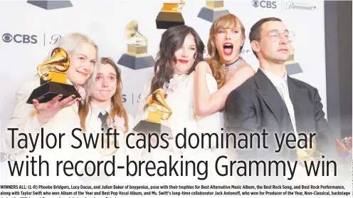  ?? ?? WINNERS ALL: (L-R) Phoebe Bridgers, Lucy Dacus, and Julien Baker of boygenius, pose with their trophies for Best Alternativ­e Music Album, the Best Rock Song, and Best Rock Performanc­e, along with Taylor Swift who won Album of the Year and Best Pop Vocal Album, and Ms. Swift’s long-time collaborat­or Jack Antonoff, who won for Producer of the Year, Non-Classical, backstage during the 66th Annual Grammy Awards in Los Angeles on Feb. 4.