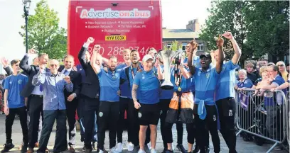  ??  ?? The team soak up the applause outside the town hall