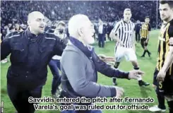  ??  ?? Savvidis entered the pitch after Fernando Varela's goal was ruled out for offside