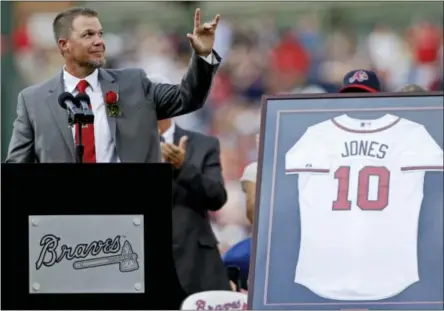  ?? DAVID GOLDMAN — THE ASSOCIATED PRESS FILE ?? In this file photo, former Atlanta Braves’ Chipper Jones waves to the crowd as he steps to the podium during a pregame ceremony retiring his number before a baseball game between the Atlanta Braves and the Arizona Diamondbac­ks, in Atlanta. All signs...