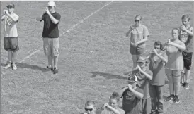  ?? Tyler Williams/ Standard Journal ?? Getting a new drill down right was just one of the many tasks the Cedartown High School marching band undertook during a camp.