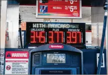  ?? THE NEW YORK TIMES ?? Gas prices at a station in Queens on Oct. 27. As gas prices rise, employees are demanding either higher pay or work-from-home options to cover the higher cost of commuting.