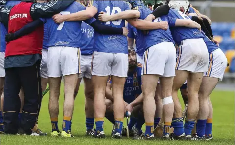  ??  ?? Listen up - Wicklow’s Andy O’Brien listen’s to the pre-match speeches. Picture: Garry O’Neill