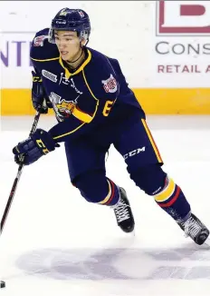  ?? VAUGHN RIDLEY/GETTY IMAGES ?? Ryan Suzuki of the Barrie Colts skates with the puck against the Niagara IceDogs at the Meridian Centre in St. Catharines. He hopes he and brother Nick will one day play in the NHL.