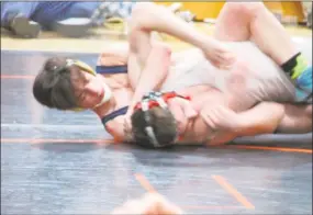  ?? Peter Wallace / For Hearst Connecticu­t Media ?? Oxford’s Tom Verdiglion­e took his 100th career win in a decision over Northweste­rn’s Colden Williamson Saturday in the Berkshire-Valley Wrestling Tournament at Thomaston High School.