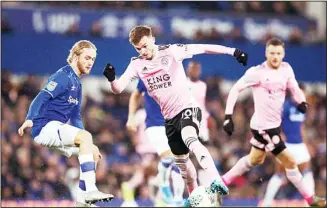  ??  ?? Leicester City’s James Maddison and Everton’s Tom Davies (left), battle for the ball during the English League Cup
quarter-final soccer match at Goodison Park, Liverpool, England on Dec 18. (AP)