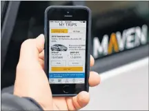  ?? AP PHOTO ?? A smartphone displays the Maven app, a General Motors car-sharing service, in Ann Arbor, Mich., in 2016.