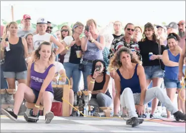  ?? JESI YOST — FOR MEDIANEWS GROUP ?? Taylor Matthews of Hamburg races Denise Zerbe of Birdsboro during the 29th annual Belt Sander Race at Bertie’s Inn in Exeter on July 13.