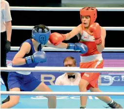  ??  ?? India’s Sakshi (in red) en route to her 4-1 win over Thailand’s fourth seed Nilawan Techasuep during her women’s 57kg second round bout at the the Asian Olympic Qualifiers in Amman, Jordan, on Wednesday.