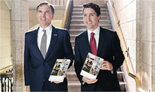  ?? ADRIAN WYLD / THE CANADIAN PRESS ?? Finance Minister Bill Morneau and Prime Minister Justin Trudeau are afraid of real tax reform, Kelly McParland writes.
