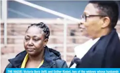  ??  ?? THE HAGUE: Victoria Bera (left) and Esther Kiobel, two of the widows whose husbands died by executions in 1995, stand outside The Hague courthouse yesterday. — AFP