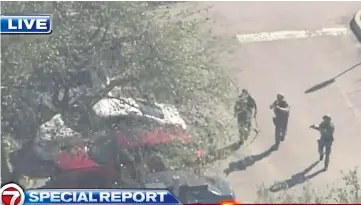  ??  ?? Armed police outside the high school in Florida where the gunman was later arrested