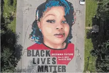  ?? JULIO CORTEZ THE ASSOCIATED PRESS FILE PHOTO ?? A ground mural depicts a portrait of Breonna Taylor. The U.S. Justice Department has found Louisville police have engaged in a pattern of violating constituti­onal rights following an investigat­ion prompted by the fatal police shooting of Taylor.