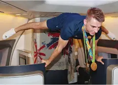  ??  ?? High flyer: Gymnast Max Whitlock shows off his skills in first class