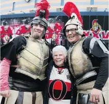  ?? WAYNE CUDDINGTON ?? Gladys Siddock of Renfrew, and Don Kellett and Trevor Bayer, as Roman soldiers, get to know one another in the Red Zone.