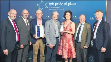  ?? (Pic: Don MacMonagle) ?? Members of Kilworth Community Council - Dan Noonan, Sean Hegarty and Michael Gowen - accepting their award from Mayor Gillian Coughlan; the Chief Executive of Cork County Council Tim Lucey, along with Peter Sheridan and Enda Devine of IPB Insurance (far left and far right) at the ipb Pride of Place awards in the INEC, Killarney.