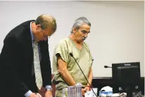  ??  ?? Jimmy Griego, right, hangs his head Monday while his attorney John G. Camp takes notes as District Court Judge Mary Marlowe Sommer sentences Griego to 6 years in prison for causing a motor vehicle crash that resulted in the death of a 40-year-old...