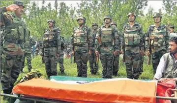  ??  ?? Armymen pay their last respects to 22yearold Lieutenant Ummer Fayaz, who was killed by militants in Kashmir’s Shopian district.
