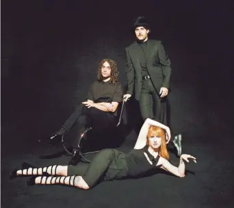  ?? ZACHARY GRAY ?? Paramore, from top: Drummer Zac Farro, guitarist Taylor York and vocalist Hayley Williams.
