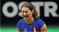  ?? AFP ?? Romania’s Niculescu breaks down after the doubles win. —