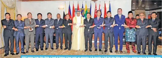  ??  ?? KUWAIT: Assistant Foreign Affairs Minister of Kuwait Ali Sulaiman Al-Saeed (center) and ambassador­s of the Associatio­n of South East Asian Nations participat­e in a ceremony hosted by the Malaysian Embassy yesterday. — Photos by Yasser Al-Zayyat