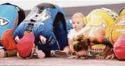  ?? Rev Del Rio / Getty Images ?? With son Brexton passing on a bit of tradition, Kyle Busch kisses the bricks along with his wife Samantha and crew members after winning Saturday’s Xfinity Series race at Indianapol­is Motor Speedway.