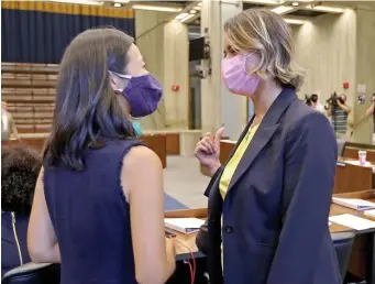  ?? STUART CAHILL / HERALD STAFF ?? COMPETITOR­S: City Councilors Michelle Wu and Annissa Essaibi George chat after they won the top two spots in the primary and will face off against each other in the race to be Boston’s next mayor.