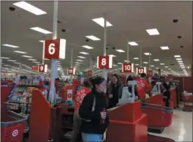  ?? MICHAEL GWIZDALA — TROY RECORD ?? Black Friday shoppers make their purchases at Target.