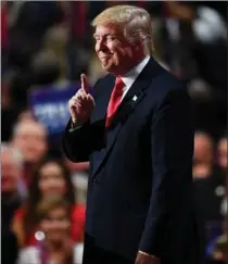  ?? JEFF J MITCHELL, GETTY IMAGES ?? Republican presidenti­al candidate Donald Trump gestures to the crowd.