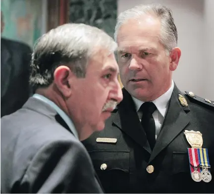  ?? TONY CALDWELL/FILES ?? Ottawa Police Chief Charles Bordeleau, right with Coun. Eli El-Chantiry, who sits on the police board. It would be best for the board to bend over backwards to listen when people tell it something’s not right, writes David Reevely.