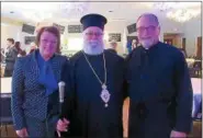  ?? PHOTO BY LEFTERIS PLEVRAKIS ?? Metropolit­an Savas with Rev. Thomas Pappalas, pastor of Sts. Constantin­e & Helen Greek Orthodox Church, and Presbytera Anne Pappalas.