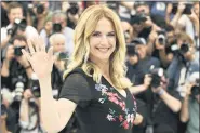  ?? PHOTO BY ARTHUR MOLA — INVISION — AP, FILE ?? In this May 15, 2018, file photo, actress Kelly Preston poses for photograph­ers during a photo call for the film ‘Gotti’ at the 71st internatio­nal film festival, Cannes, southern France. Actress Kelly Preston, whose credits included the films “Twins” and “Jerry Maguire,” died Sunday, July 12, 2020, her husband John Travolta said. She was 57.