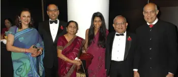  ??  ?? MAKING A MARK: (From left) Meena Pathak, Kalpesh Solanki, Parvatiben Solanki, Poulomi Solanki, Ramniklal Solanki and Kirit Pathak at the 2011 Asian Trader Awards