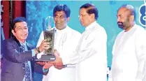  ??  ?? PROMET Chairman M.A. Justin receiving the award from President Maithripal­a Sirisena