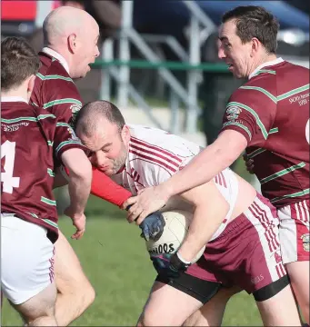  ??  ?? St. Vincent’s Robbie Lynch is surrounded by Ballivor players during Sunday’s Tailteann Cup semi-final in Ardcath.