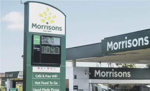  ?? PICTURE: JOHN DEVLIN ?? 0 Morrisons has cut its petrol to no more than 99.7p a litre and its diesel to no more than 104.7p