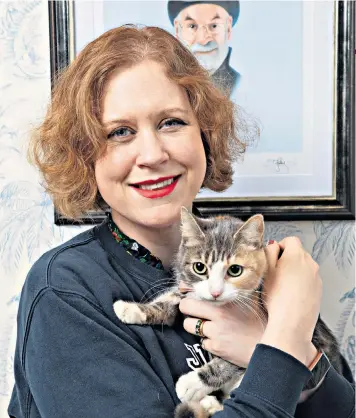  ??  ?? Life-enhancing: Kat Brown with ‘Found Cat’, now renamed as Genevieve