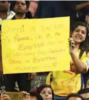  ?? — BCCI ?? A Chennai Super Kings fan with a placard in Pune on Sunday.