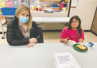  ??  ?? Child care worker Amy Lauwers serves up breakfast at Prince Charles Elementary school in north Surrey, one of the more than 100 schools seeking help from The Vancouver Sun's Adopt-a-school campaign.