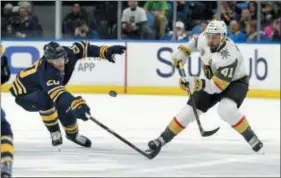  ?? ADRIAN KRASU — THE ASSOCIATED PRESS ?? Vegas winger Pierre-Edouard Bellemare, seen in a game against the Sabres Saturday, helped lead the Golden Knights to a 3-2 win over the Flyers Monday in Bellemare’s first trip back to Philadelph­ia with the expansion club.